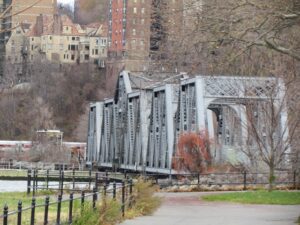 A bridge that is in the middle of a park.