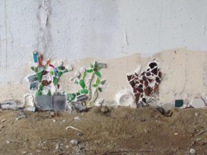 A wall with some broken glass on it