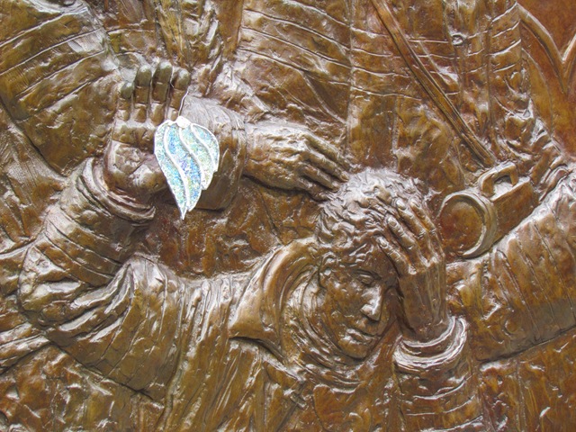 A close up of the hands and feet on a wall