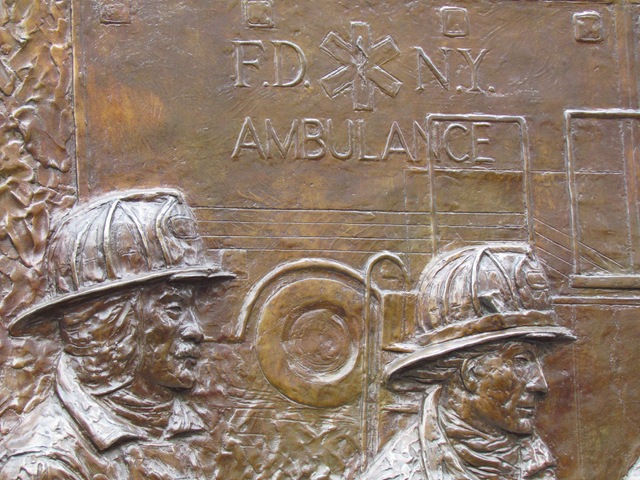A close up of the fire fighters on the side of an ambulance.