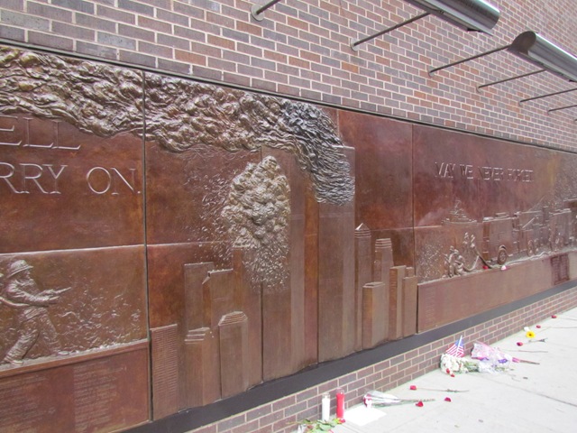 A wall with many different types of graffiti on it.