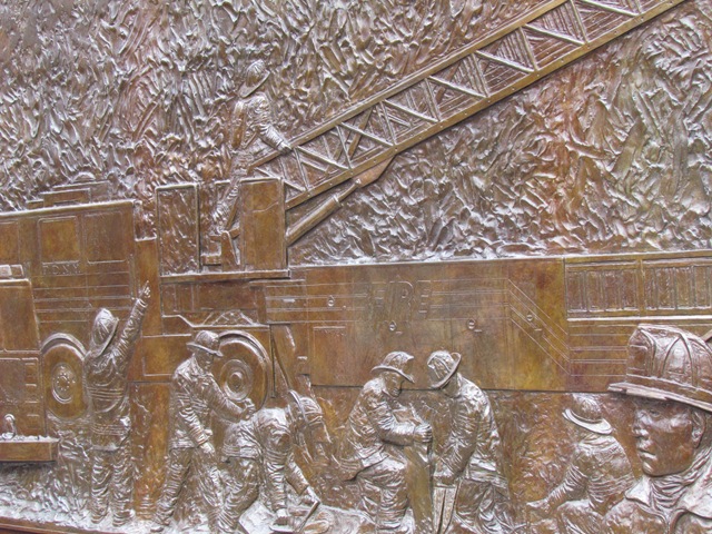 A close up of the bronze relief on the wall